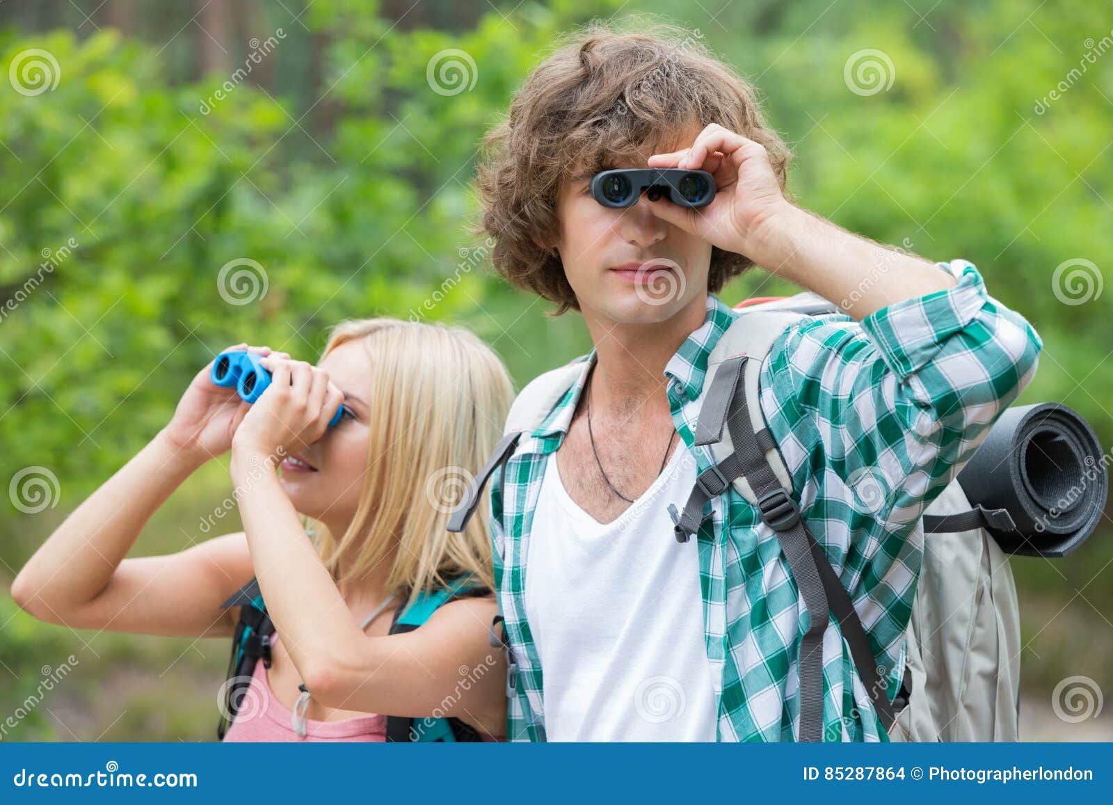 Hiking Couple Using Binoculars in Forest Stock Photo Image of