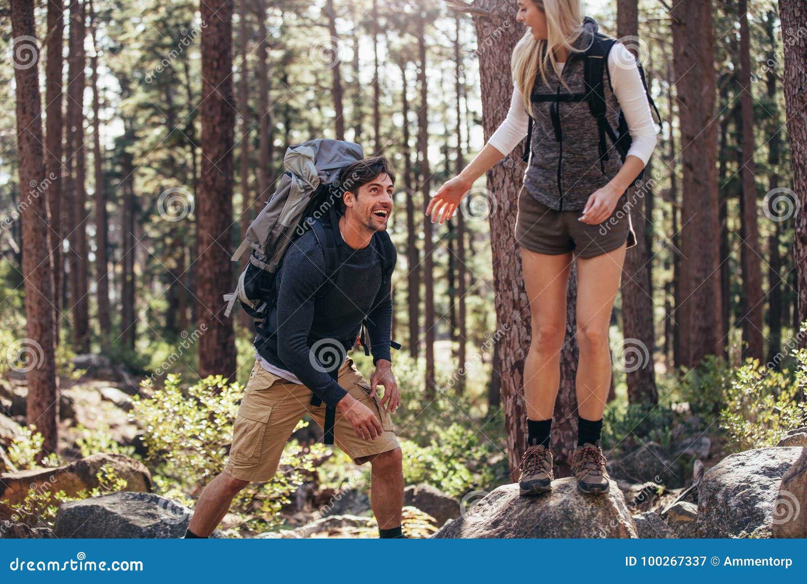 Hiking Couple Walking On Rocks In Forest Wearing Backpacks Stock Image Image Of Sunny Rocks