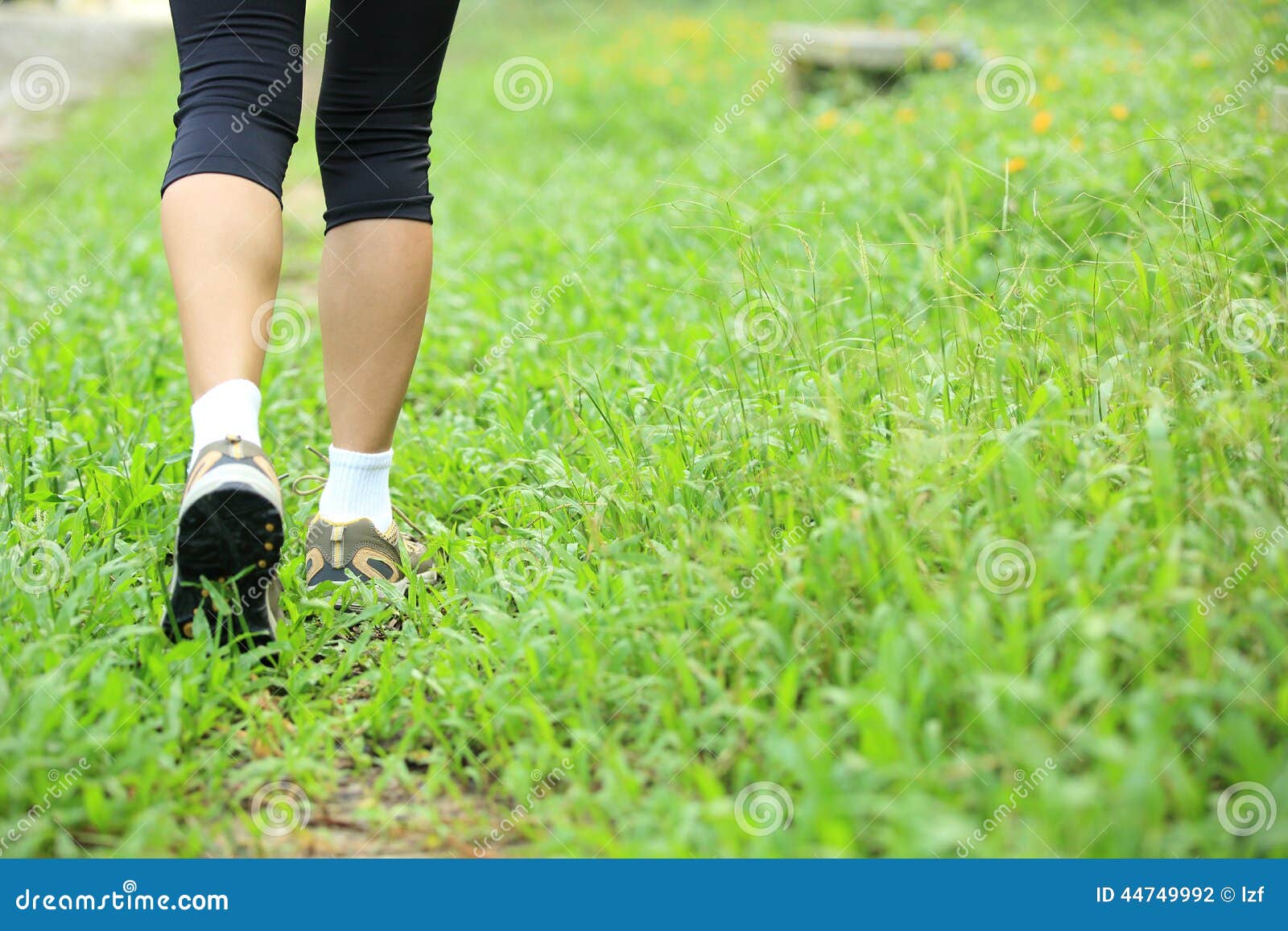 Hiking legs on green grass stock photo. Image of legs 44749992