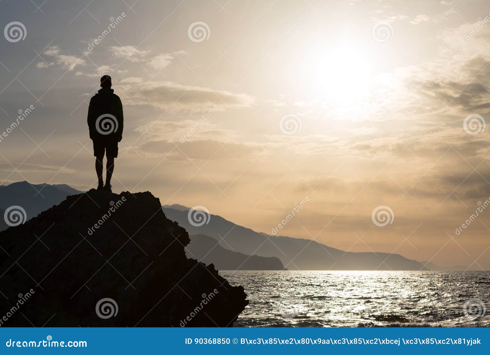 hiking silhouette backpacker, man looking at ocean