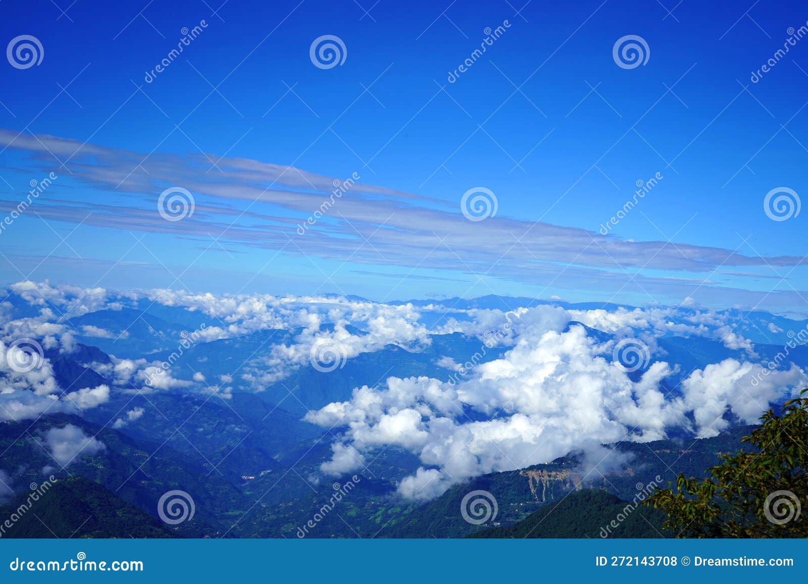 himalayan range skyline with floating clouds