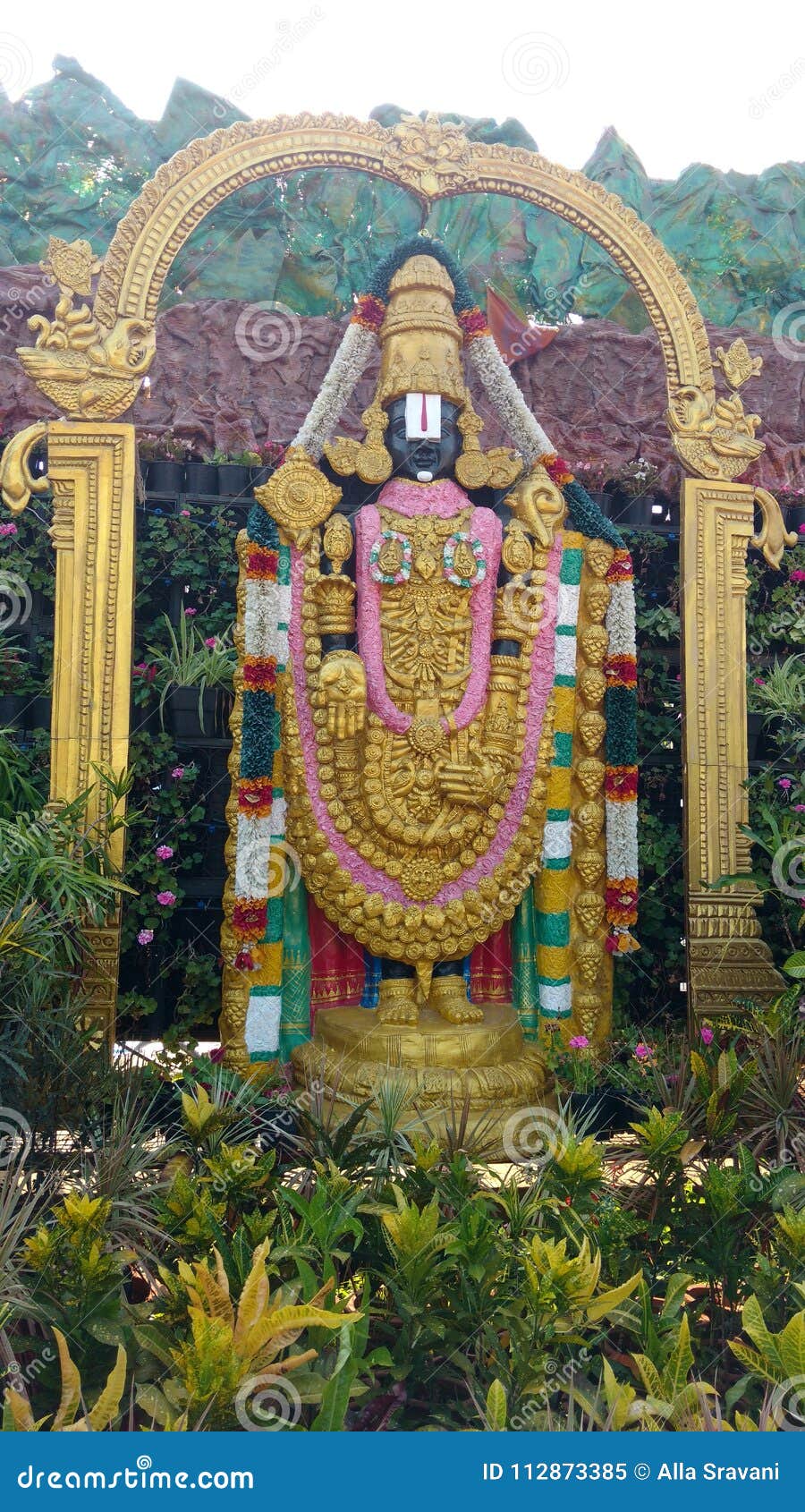 Hindu God Lord Venkateswara Statue with Full of Greenery Stock ...