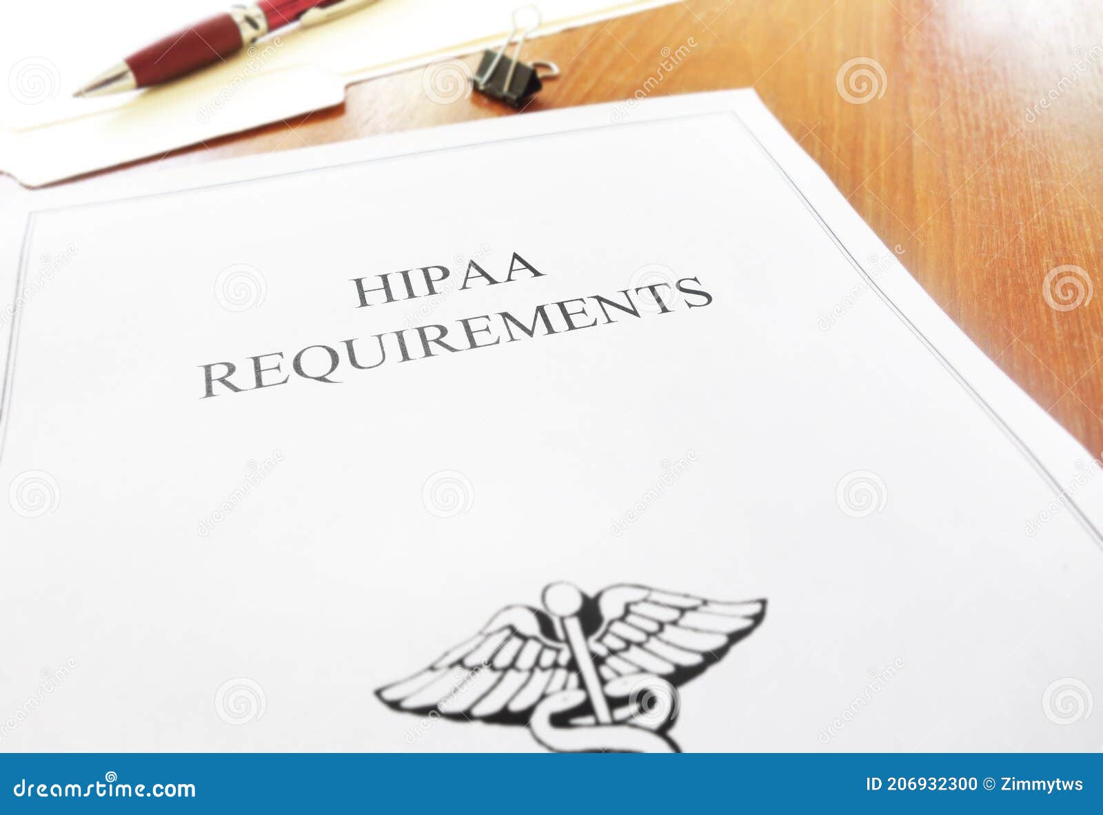 HIPAA Healthcare Requirements Document on Office Desk Stock Photo