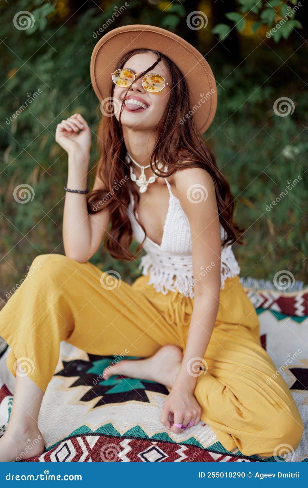 Hippie Woman in Eco Clothing Laughs and Wiggles As she Sits on a Plaid ...
