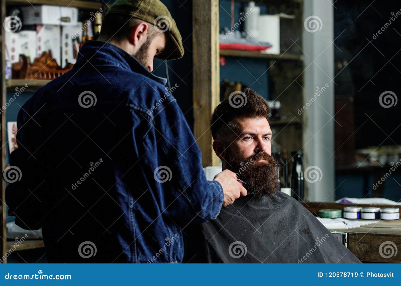 Hipster with Beard Covered with Cape Serving by Professional Barber in ...