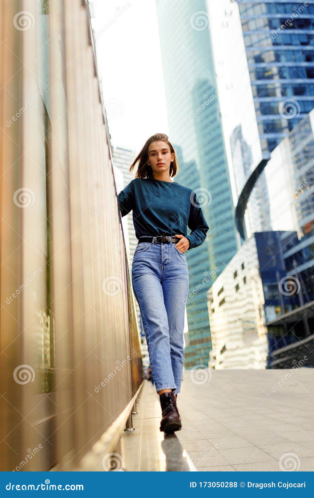 Full length photo of beautiful teenage girl 20s with double buns hairstyle  wearing jeans clothing and backpack smiling at camera isolated over white b  Stock Photo - Alamy