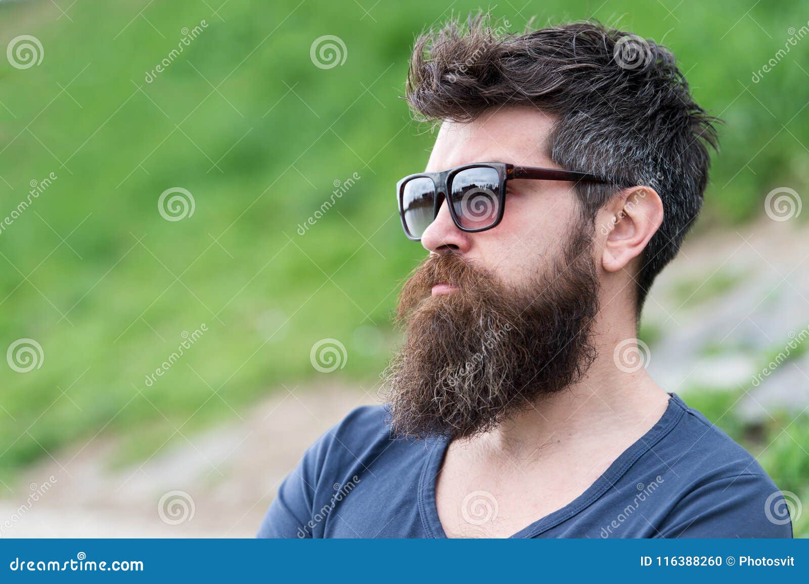 Hipster Man in Trendy Sunglasses Standing on Slope with Lush Green Glass in  Spring. Bearded Man with Stylish Hairstyle Stock Photo - Image of male,  attractive: 116388260
