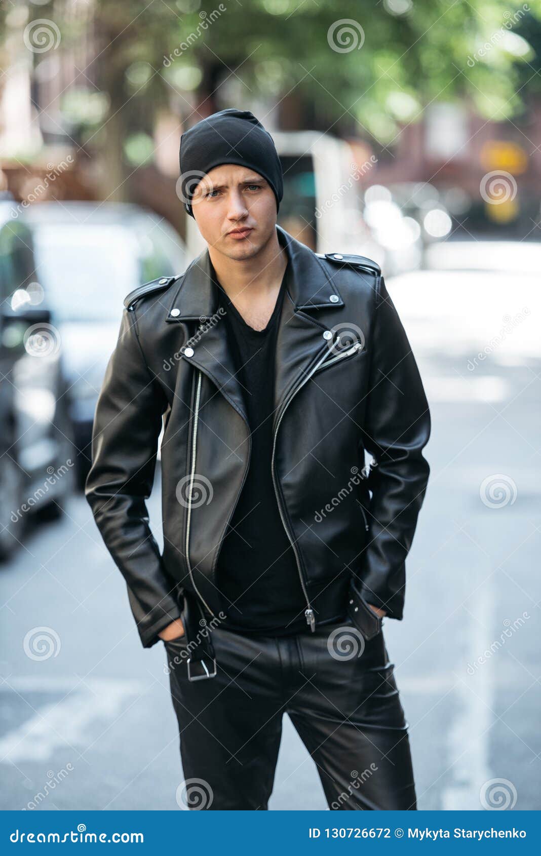 Hipster Man Wearing Black Style Leather Outfit With Hat Pants Jacket And Shoes Standing On