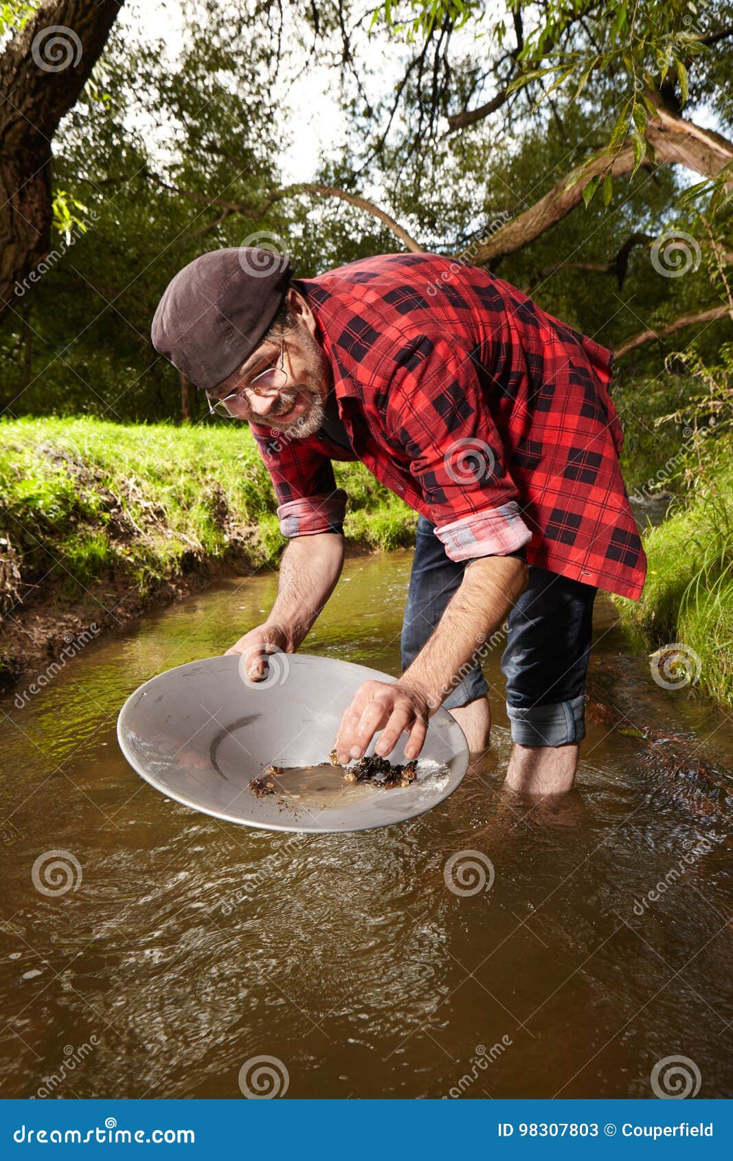 Hipster Prospector Panning Sand In Creek For Gold Stock Image - Image ...