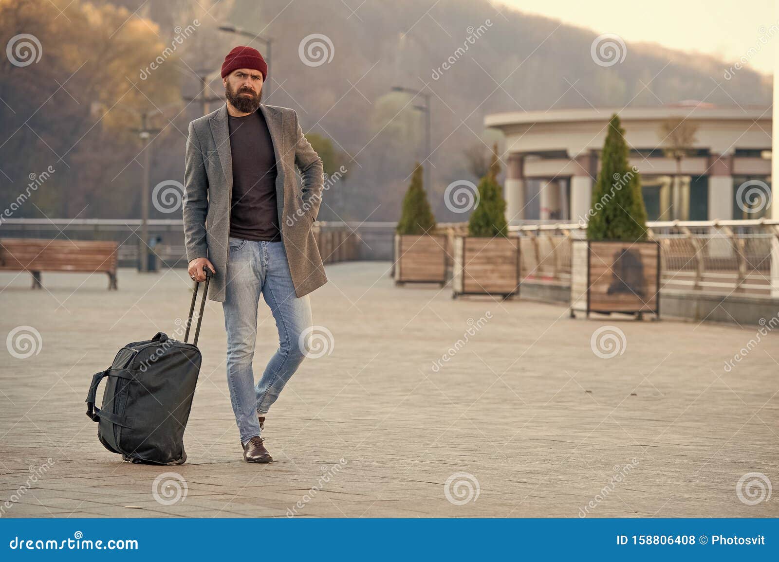 Mature hipster with beard. Bearded man walking on street. modern