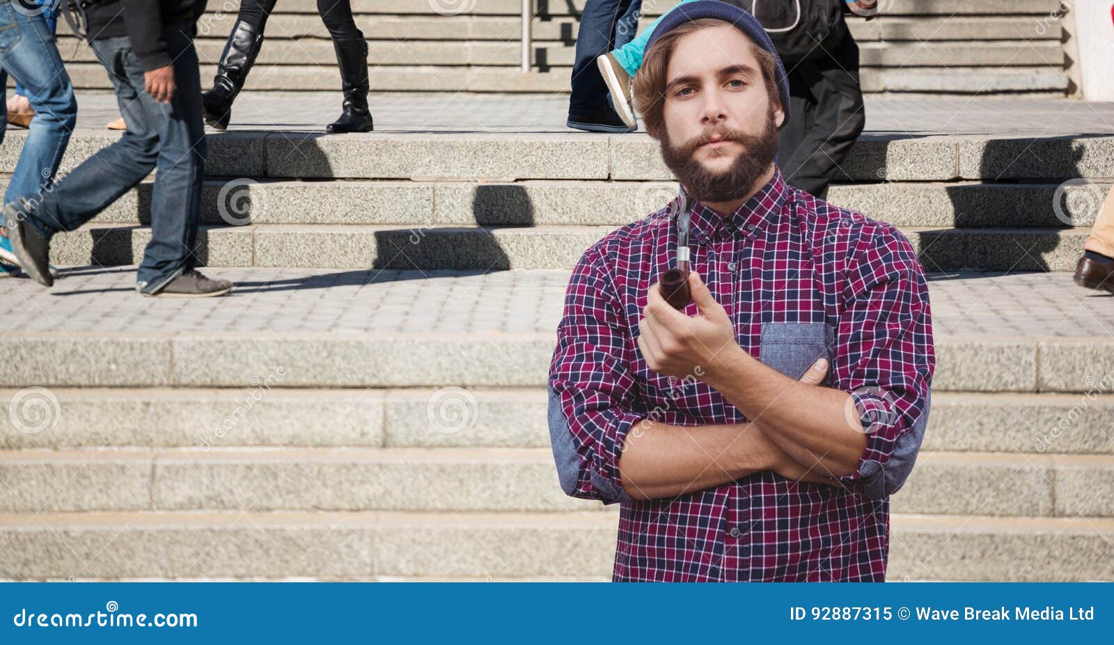Hipster Smoking Pipe on Steps Stock Image - Image of hipster, crossed