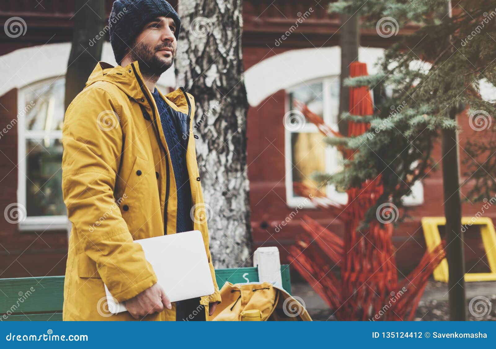 Hipster with Yellow Backpack, Jacket, Cap, Thermos Cup of Coffee ...