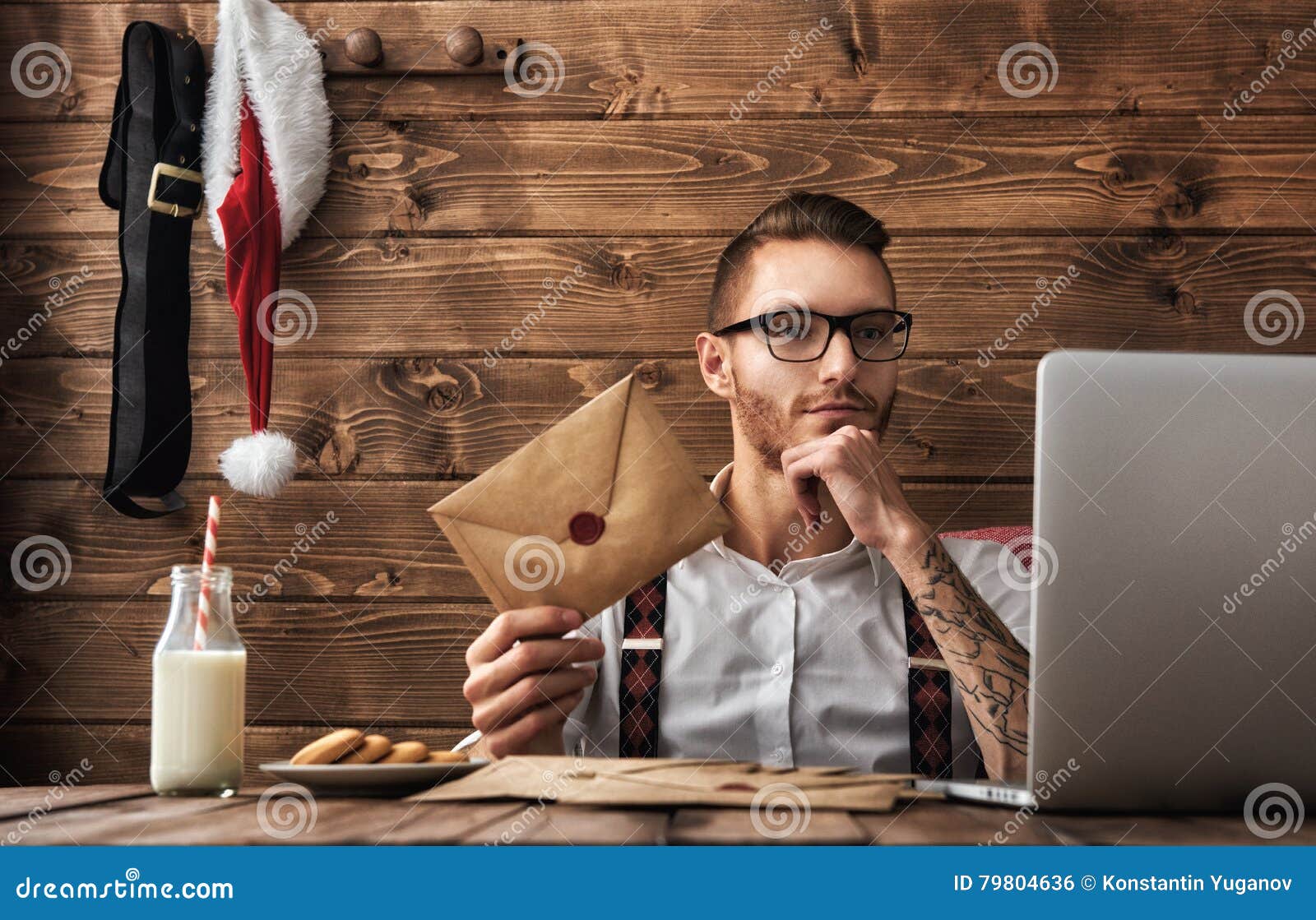Merry Christmas and Happy Holidays Handsome man with Santa symbol Hipster young Santa Claus concept