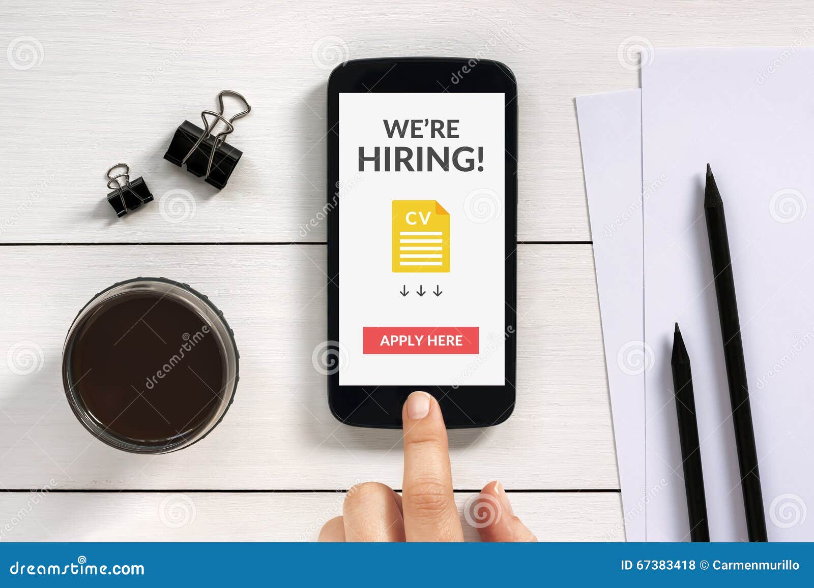 we are hiring apply now concept on smartphone screen with office