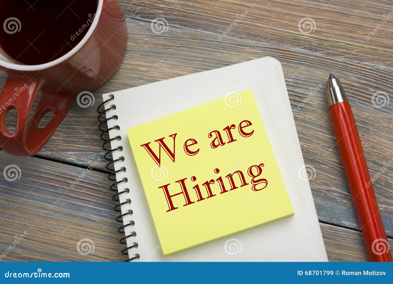 We are Hiring. Office Desk Table with Notepad, Pencil and Coffee Cup. Top View. Stock Image