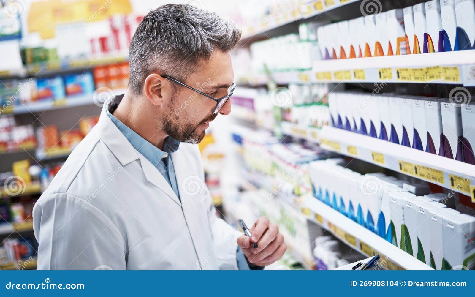 His Pharmacy Has the Best Brands. a Mature Pharmacist Doing Inventory