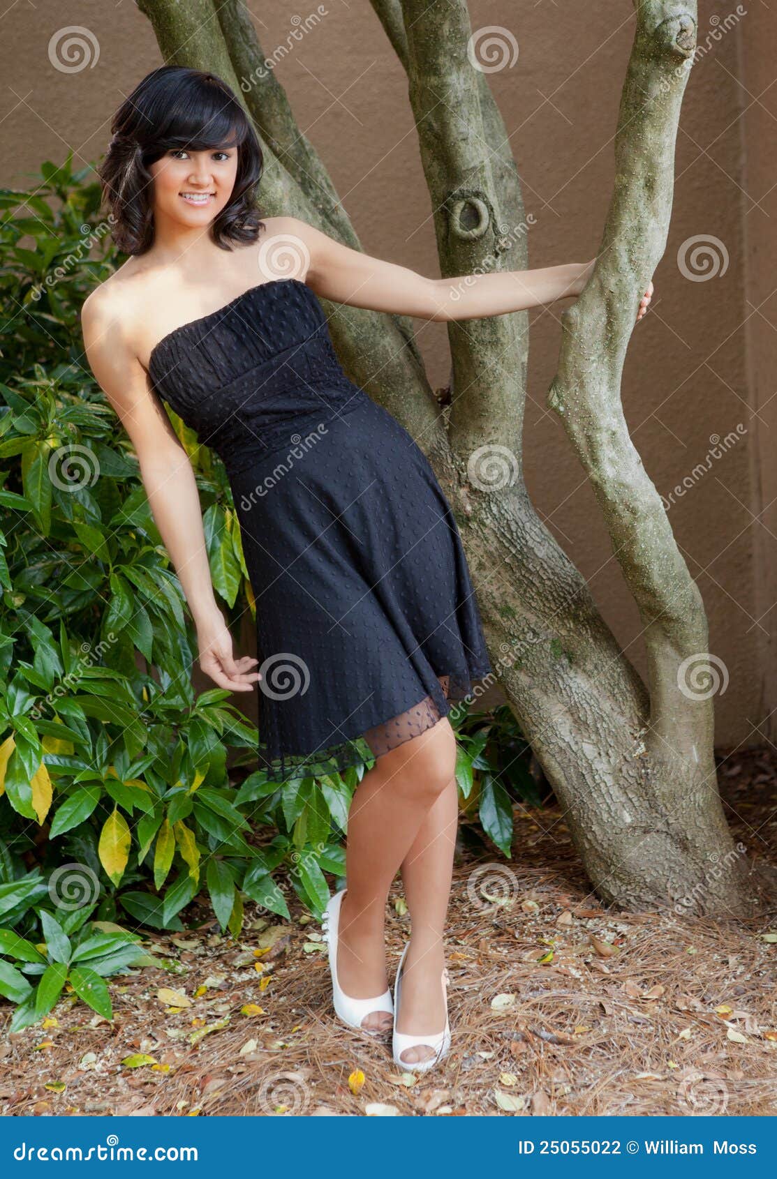 hispanic/asian teen in dress outside