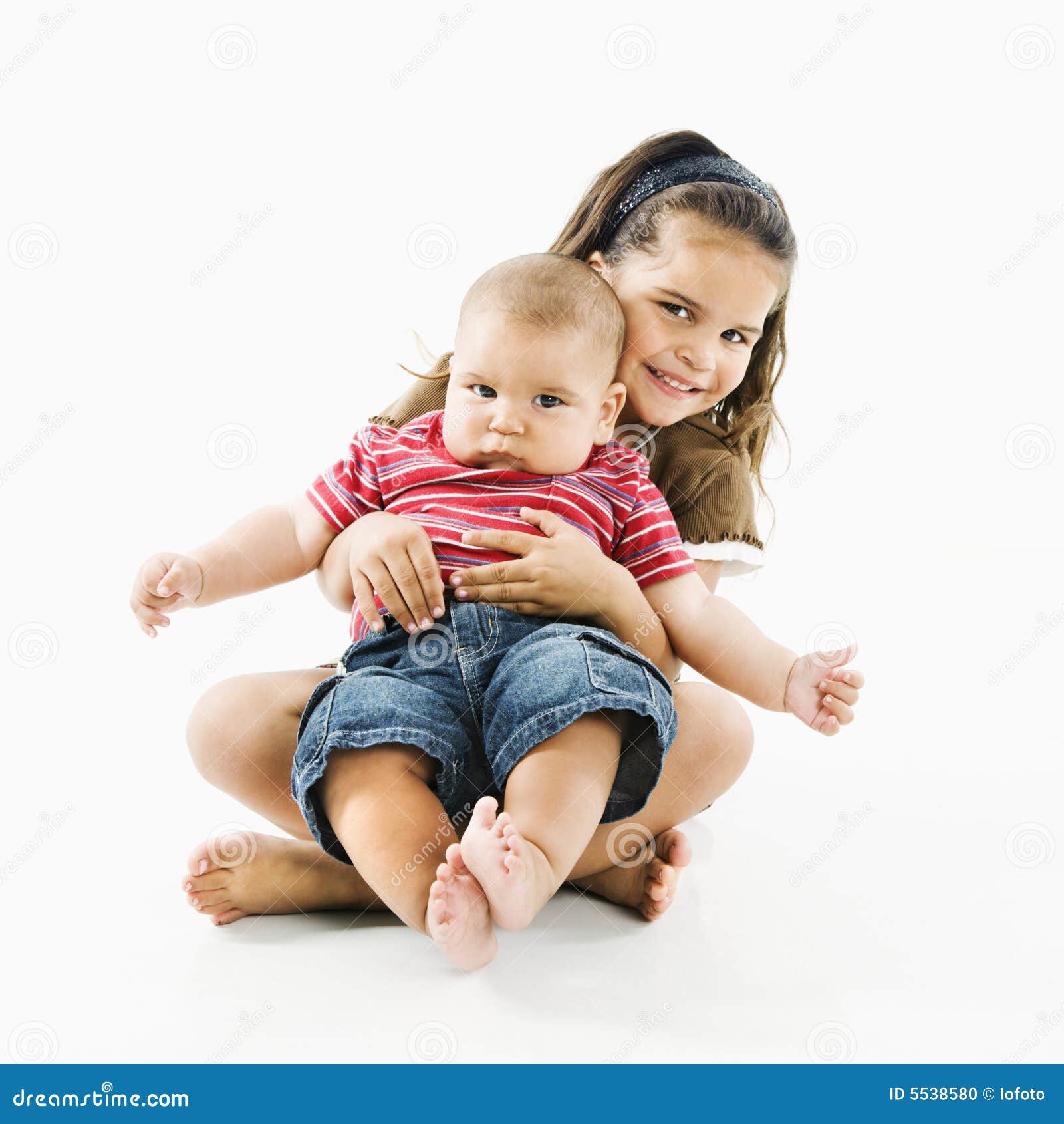 Hispanic Child Holding Baby. Stock Photo Image of cute, family 5538580