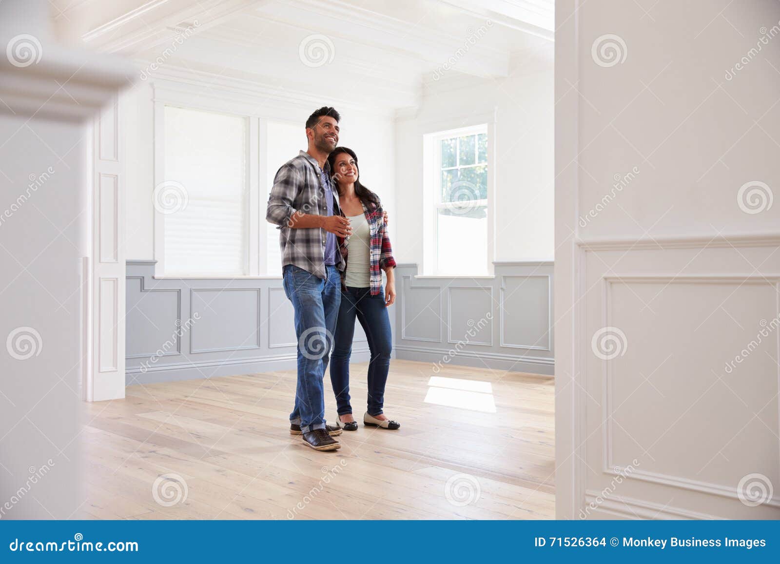 hispanic couple viewing potential new home
