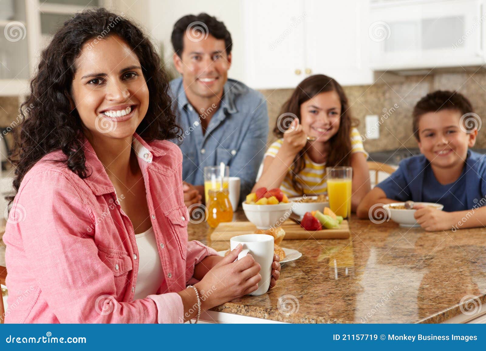hispanic family eating breakfast