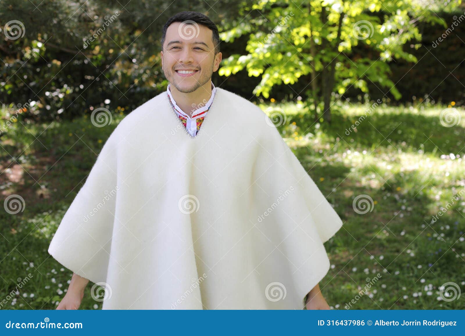 hispanic man wearing a ruana