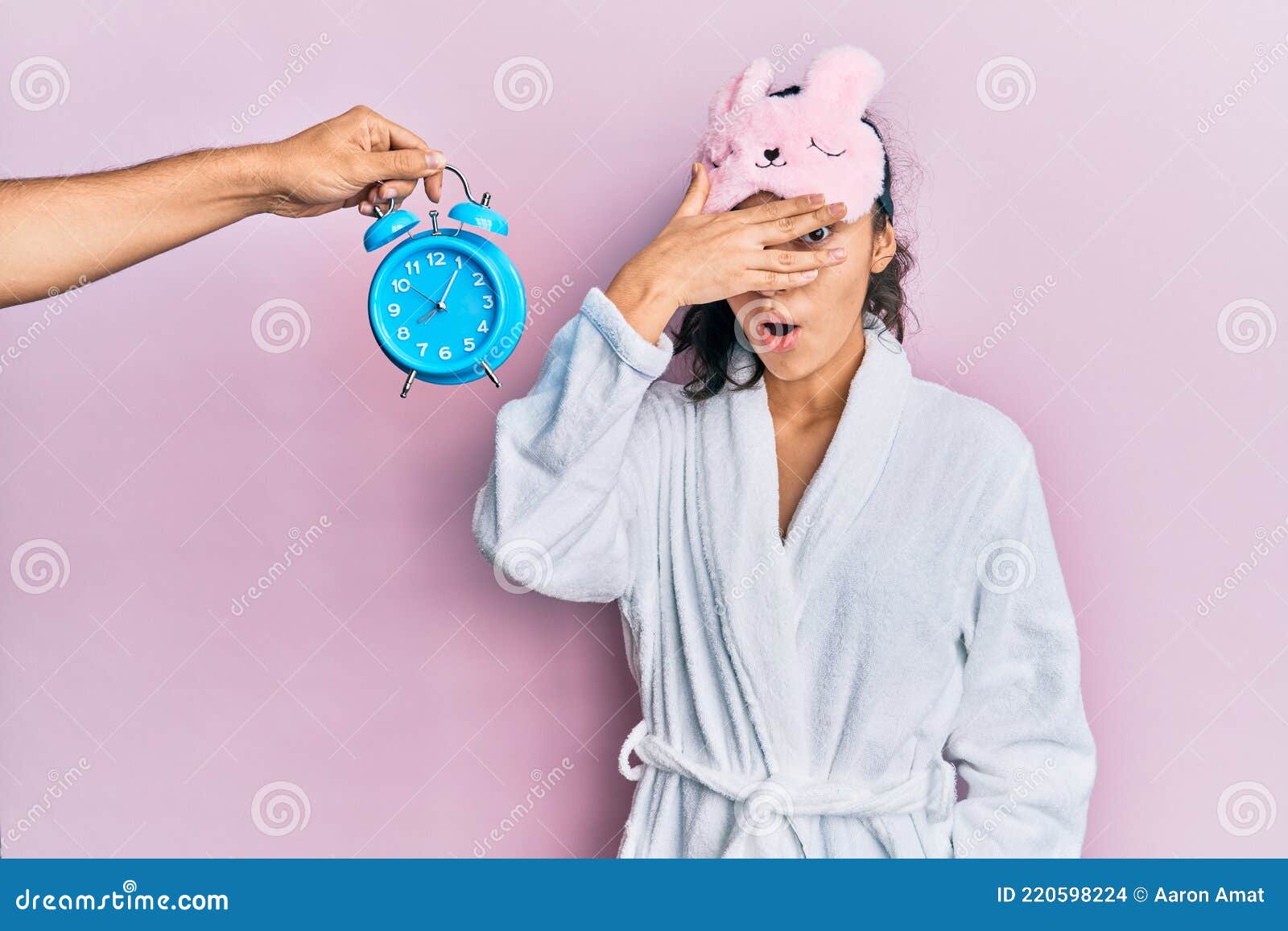 Hispanic Teenager Girl with Dental Braces Wearing Sleep Mask and Robe with  Alarm Clock Close To Her Peeking in Shock Covering Face Stock Photo - Image  of mask, finger: 220598224