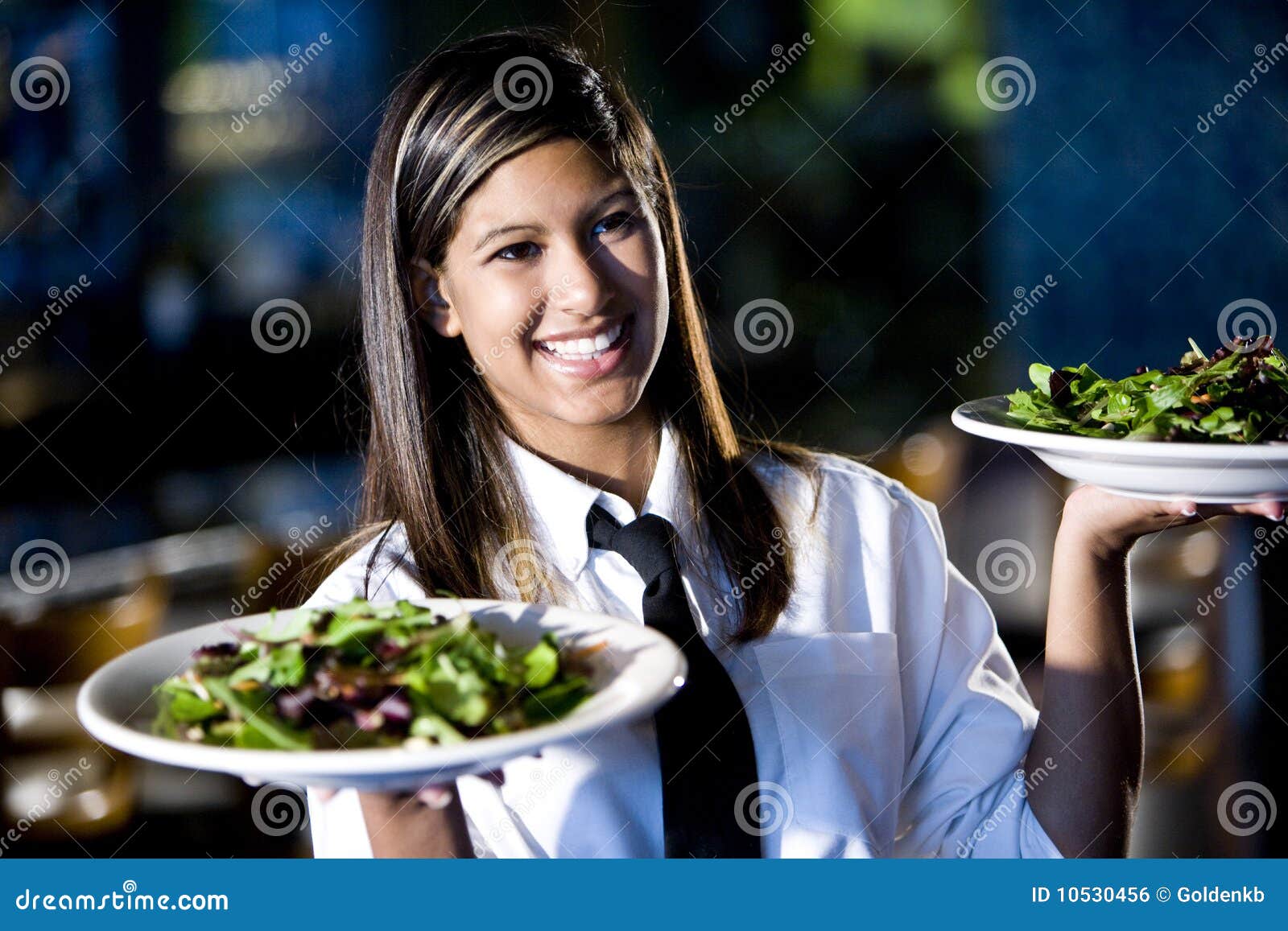 Hispanic Waitress in Restaurant Serving Salads Stock Photo Image of