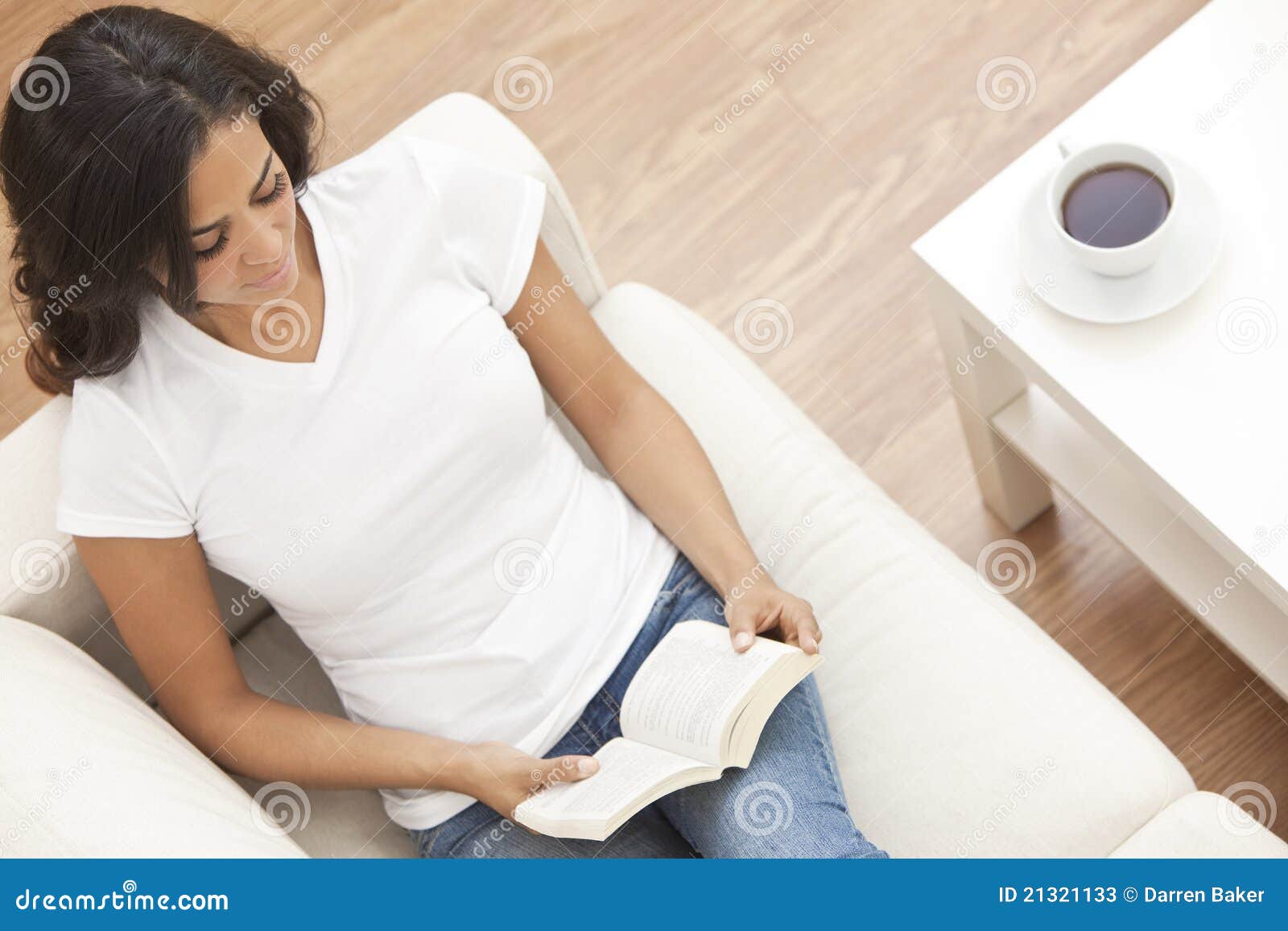 Hispanic Woman Reading Book Drinking Tea or Coffee Stock Image Image