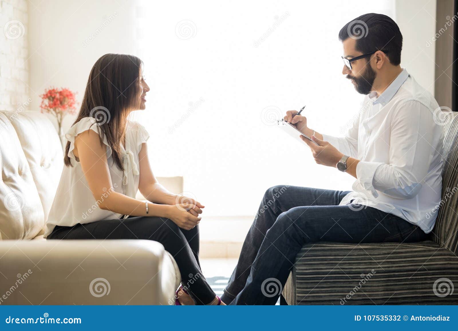 hispanic woman talking to her therapist at therapy session