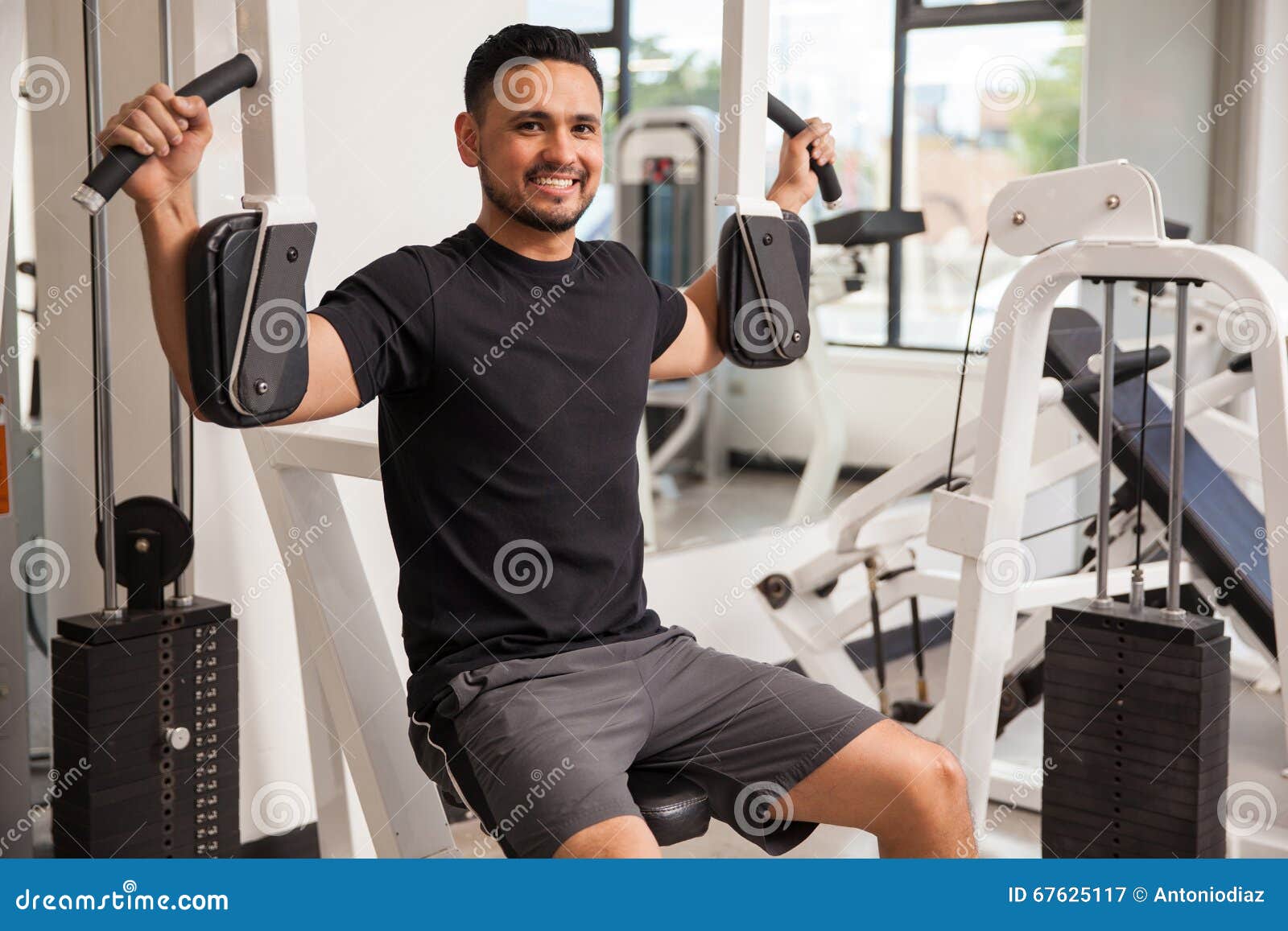 Latino Man Exercising At Home On An Elliptical During The Covid 19 Stock  Photo - Download Image Now - iStock