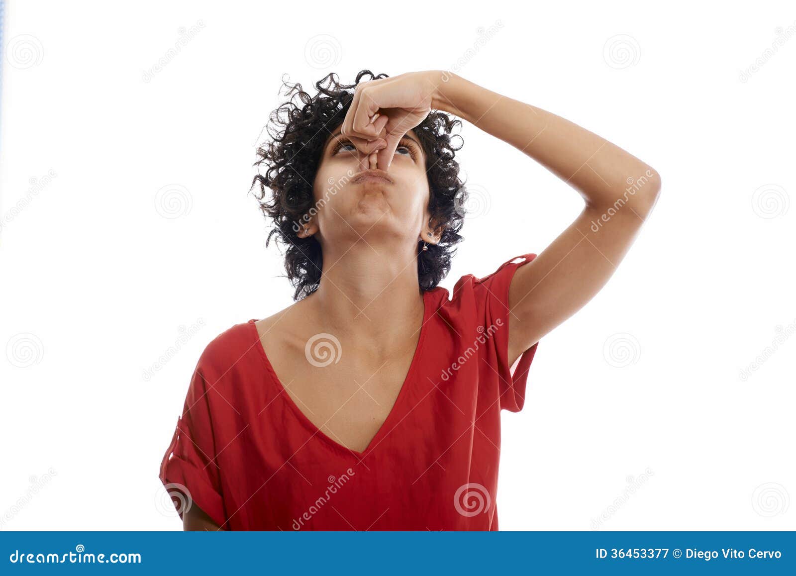 hispanic young woman holding breath