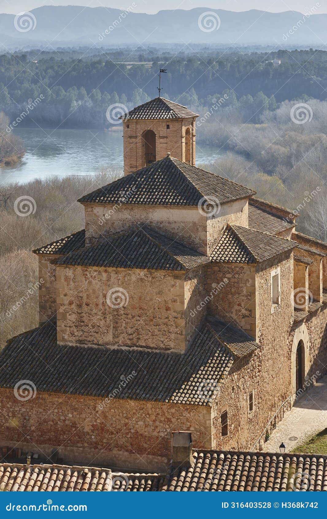 historic church of miravet and ebro river. tarragona. catalunya, spain