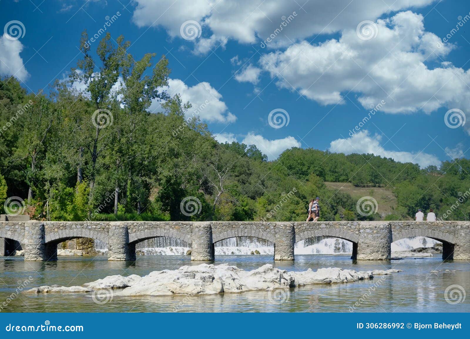 historic stone bridge over the serene ardeche river