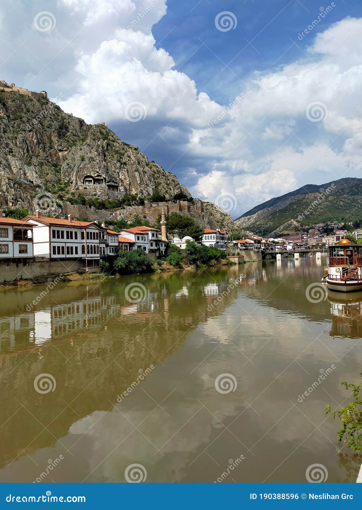 historical amasya houses on the banks of the kÃÂ±zÃÂ±lÃÂ±rmak river and kralkaya  king rock tombs cemeteries on the back.