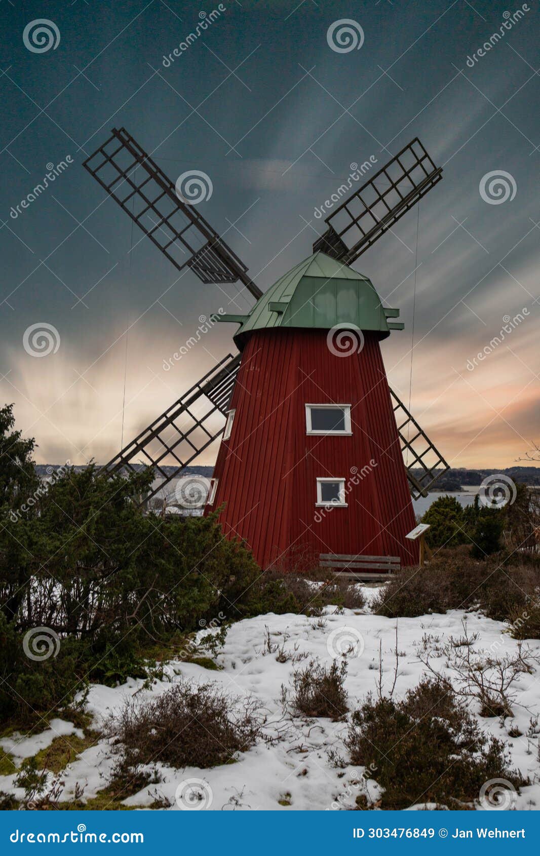 historical windmill made of red wood in a winter landscape.stenungsund in sweden