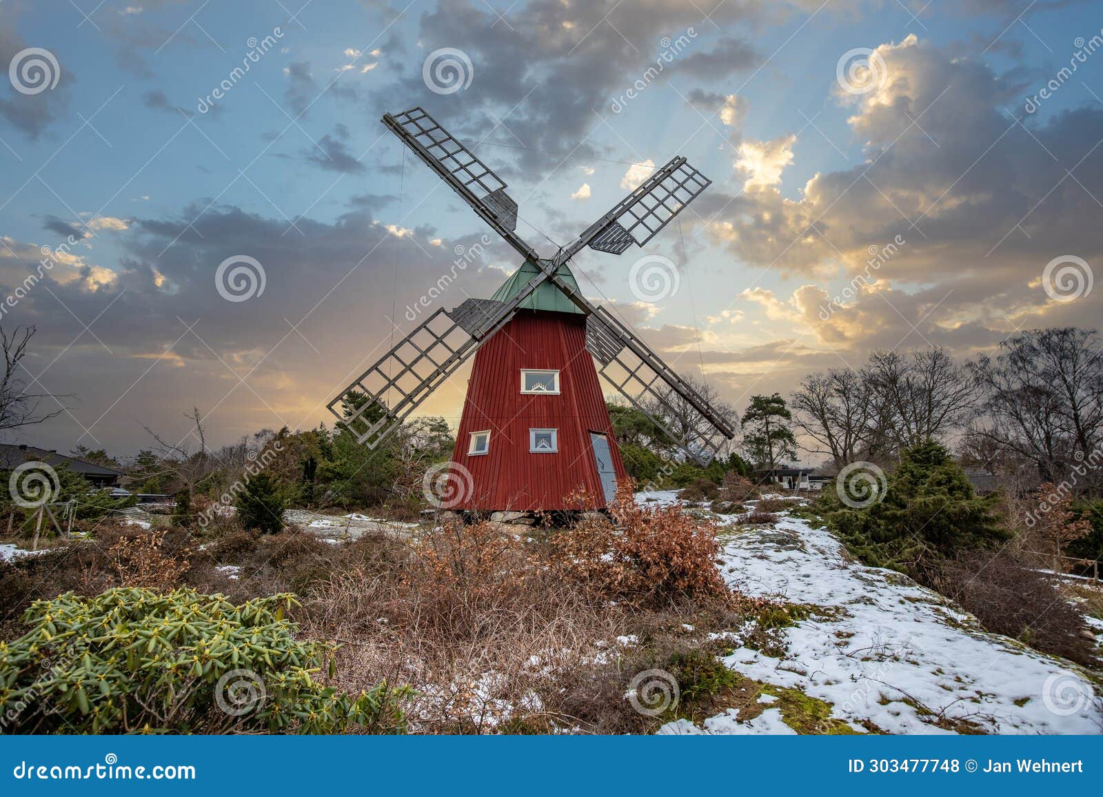 historical windmill made of red wood in a winter landscape.stenungsund in sweden