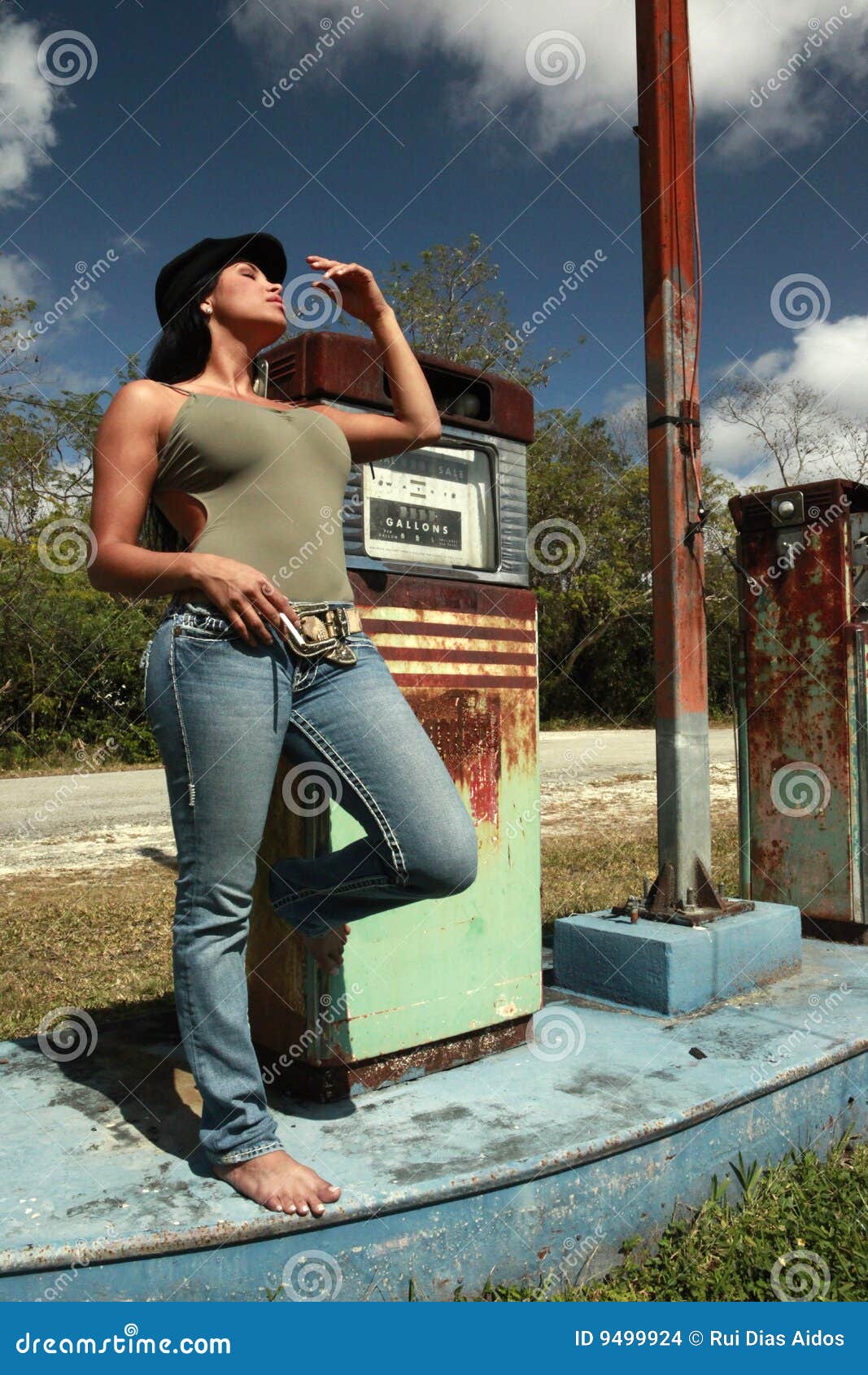 Hitchhiker At A Vintage Gas Station Stock Photo - Image: 9499924