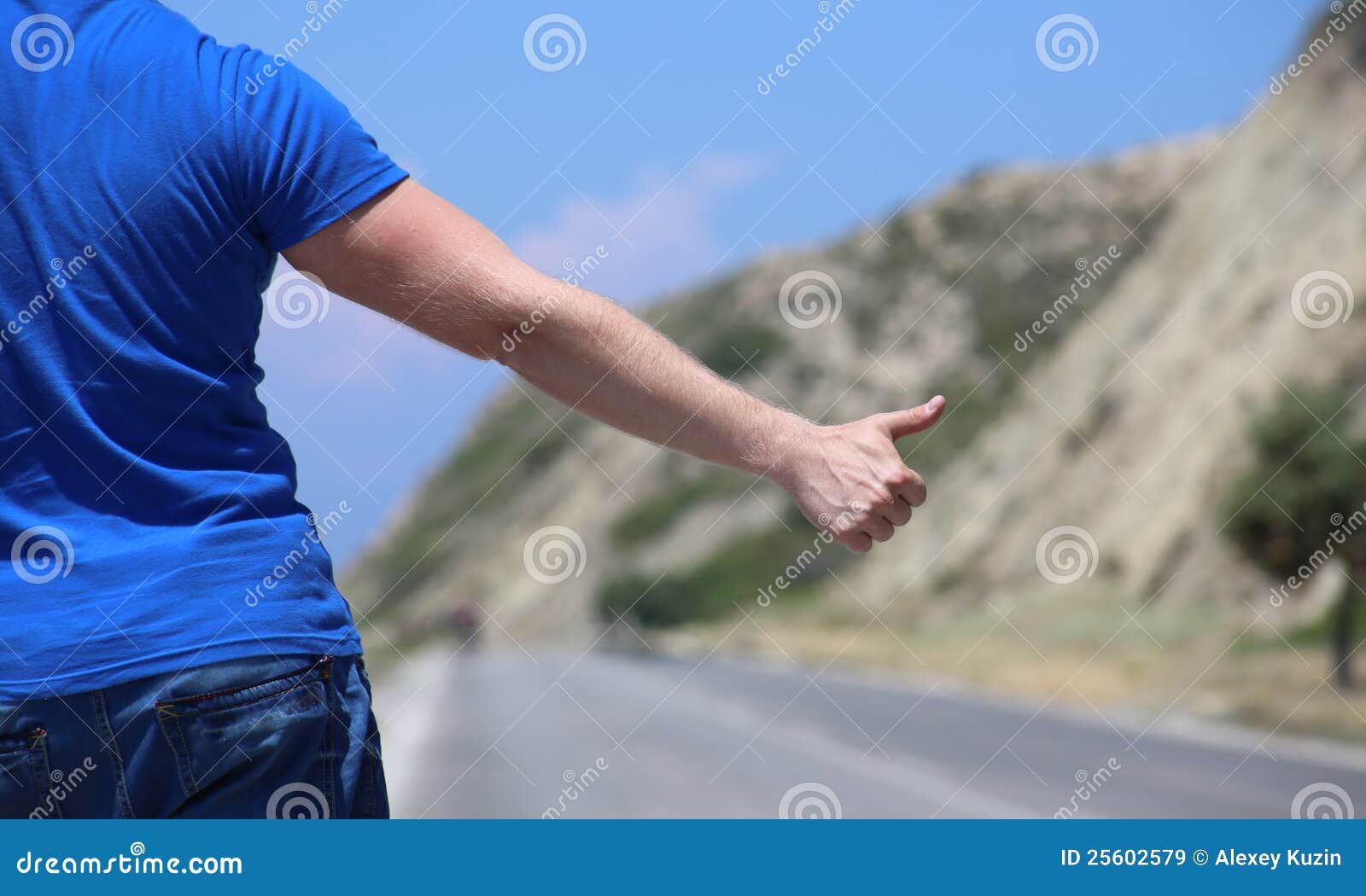 Hitchhiking stock image. Image of thumbs, blue, mountain 25602579
