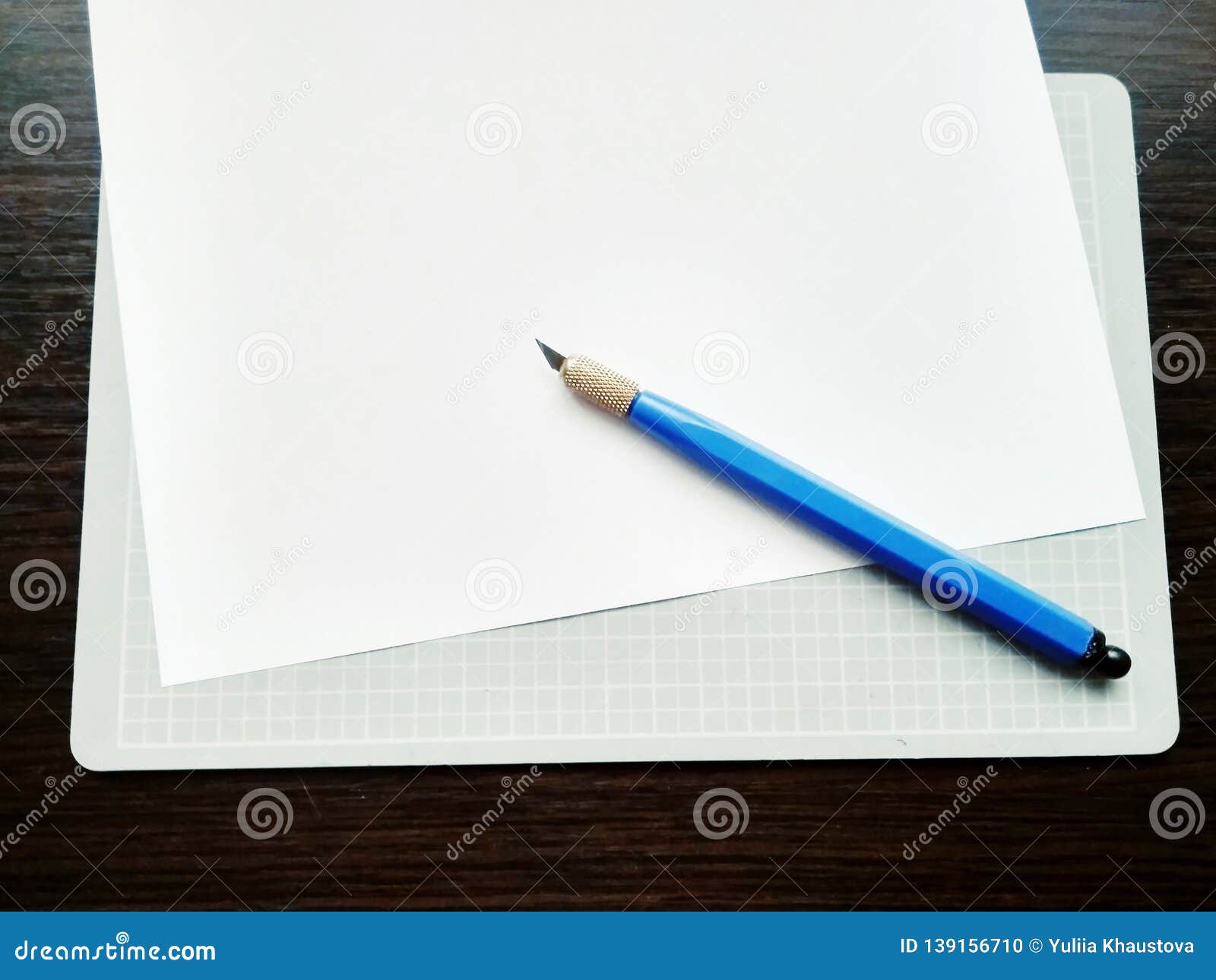 Cutting Out Paper on a Rug with a Cutter Stock Photo Image of tool