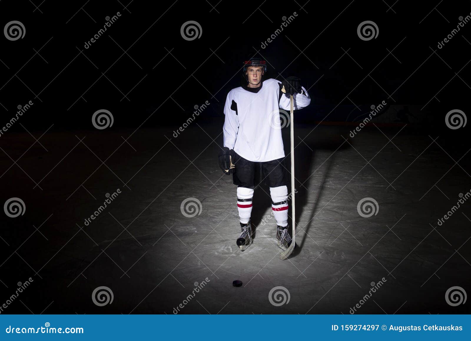 Hockey Player. Portrait of a Handsome Icehockey Player with Hockey
