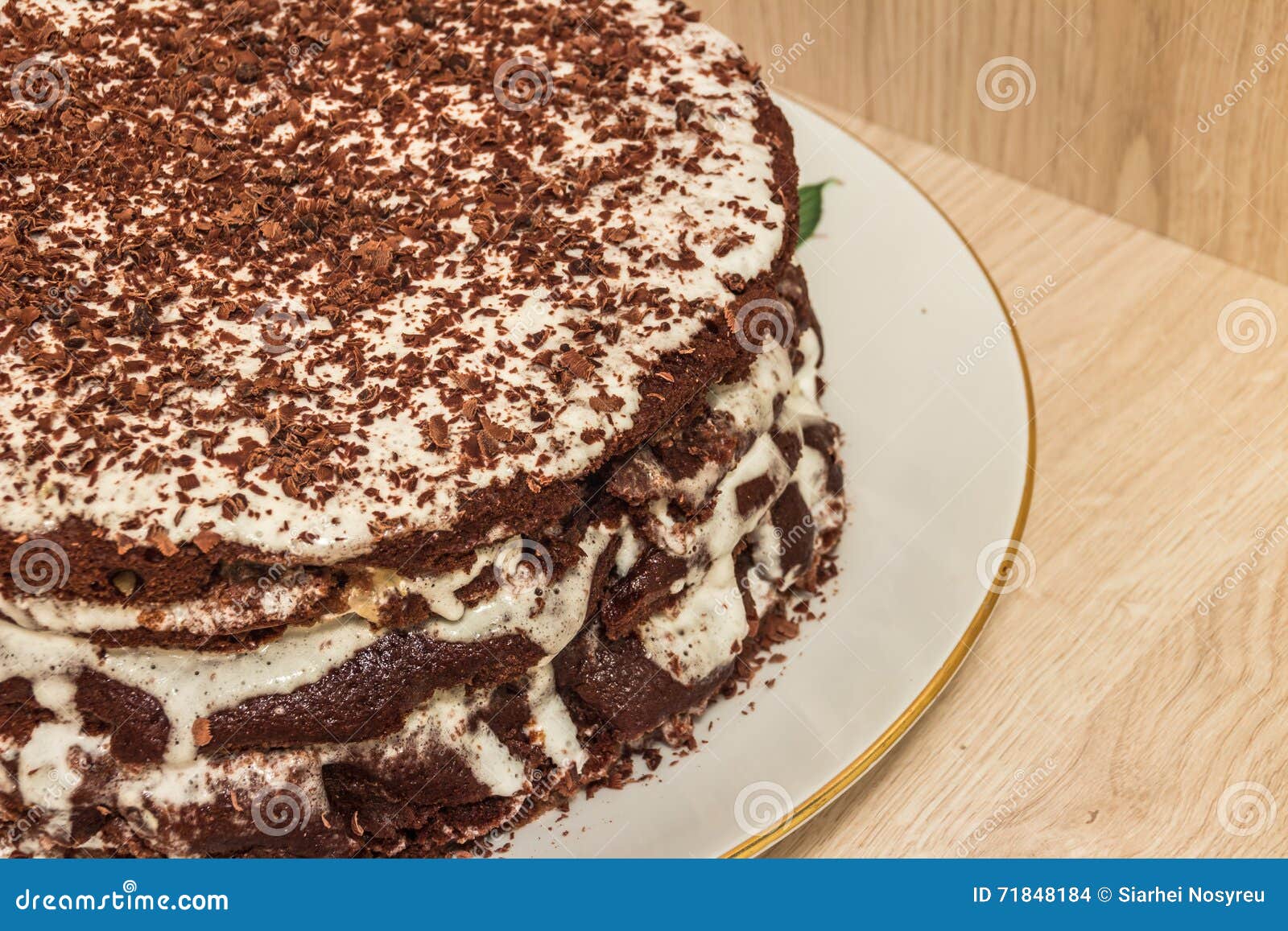ÃÂ¡hocolate cake is soaked in sour cream and decorated with chocolate shavings