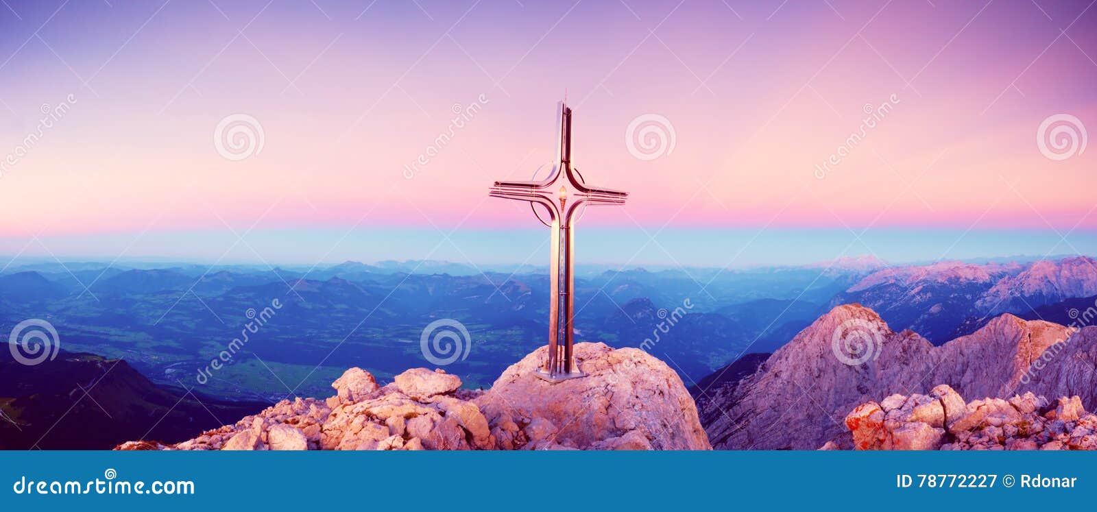 hoher goell autumn daybreak panorama. iron cross at mountain top