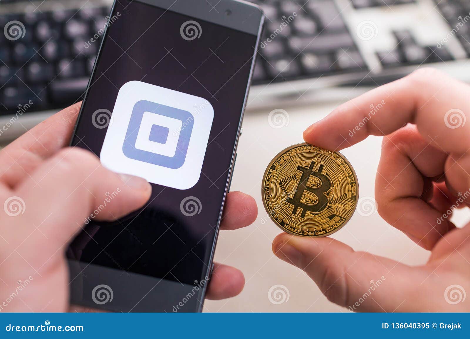 Holding Bitcoin Coin With Square Application Editorial