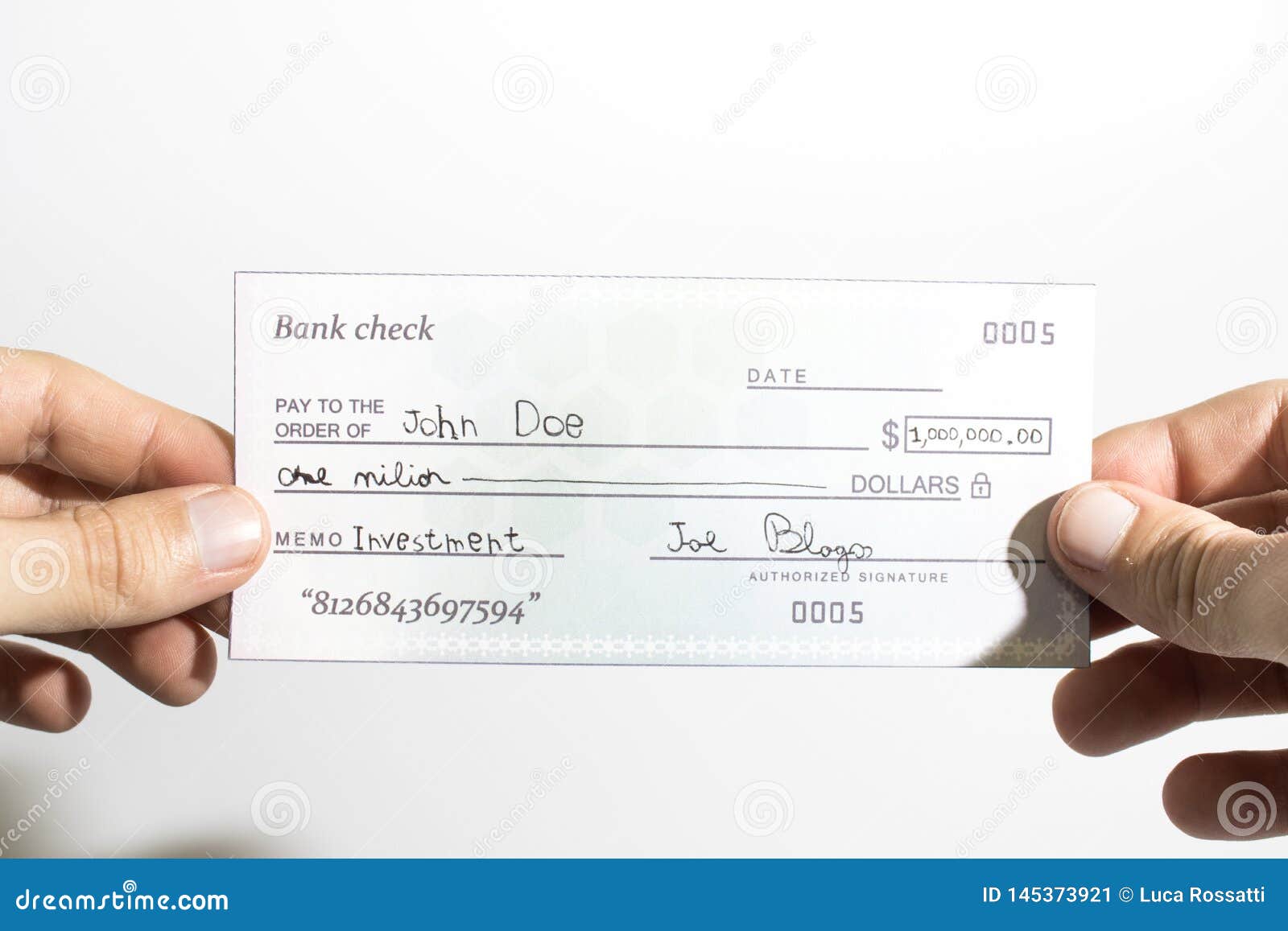 holding a million dollar bank check  in a white background