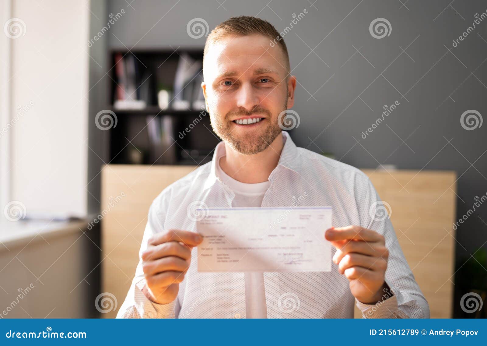 Holding Paycheck in Hand stock image. Image of management 215612789