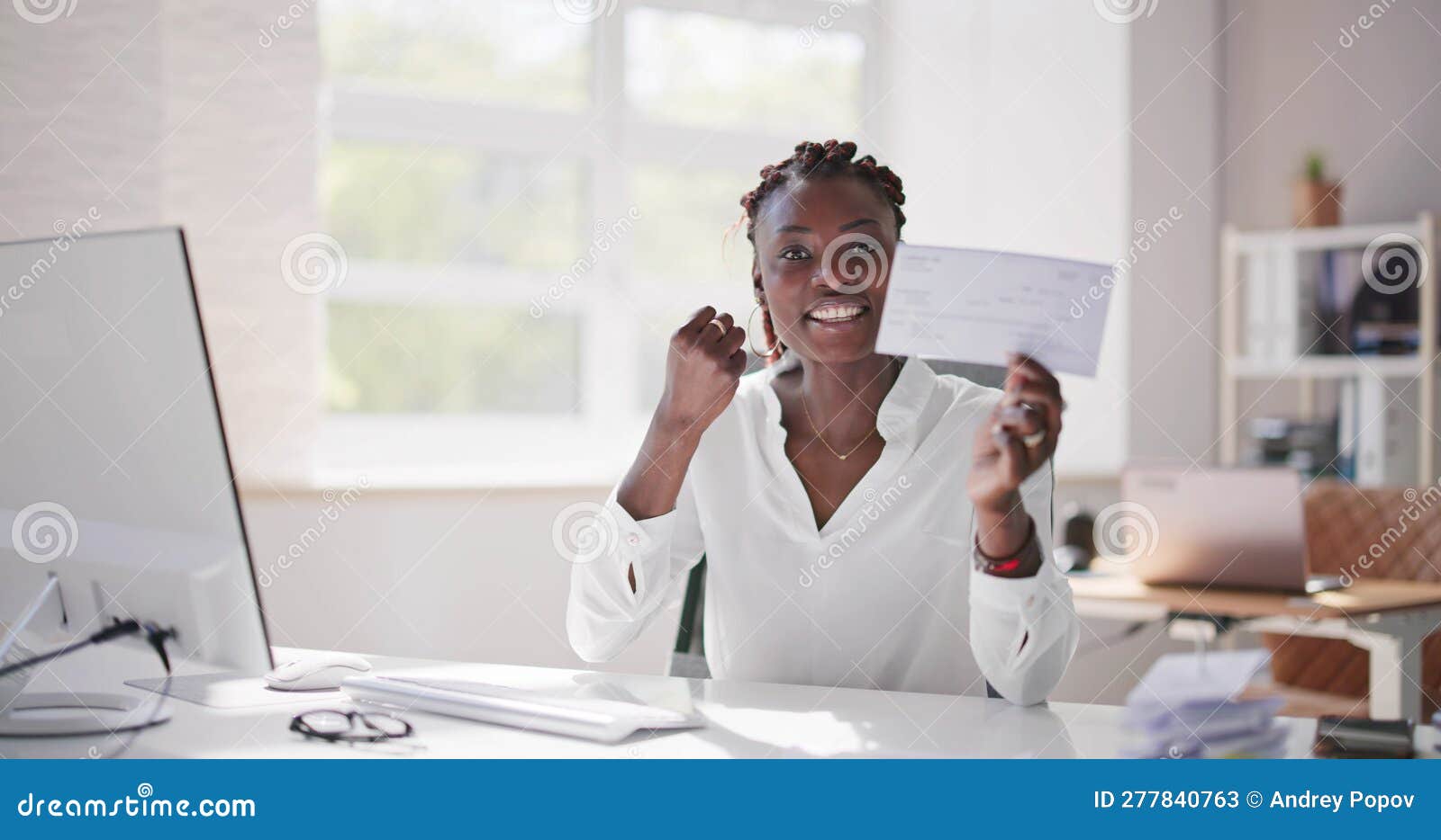 Holding Paycheck or Payroll Check or Insurance Cheque Stock Image