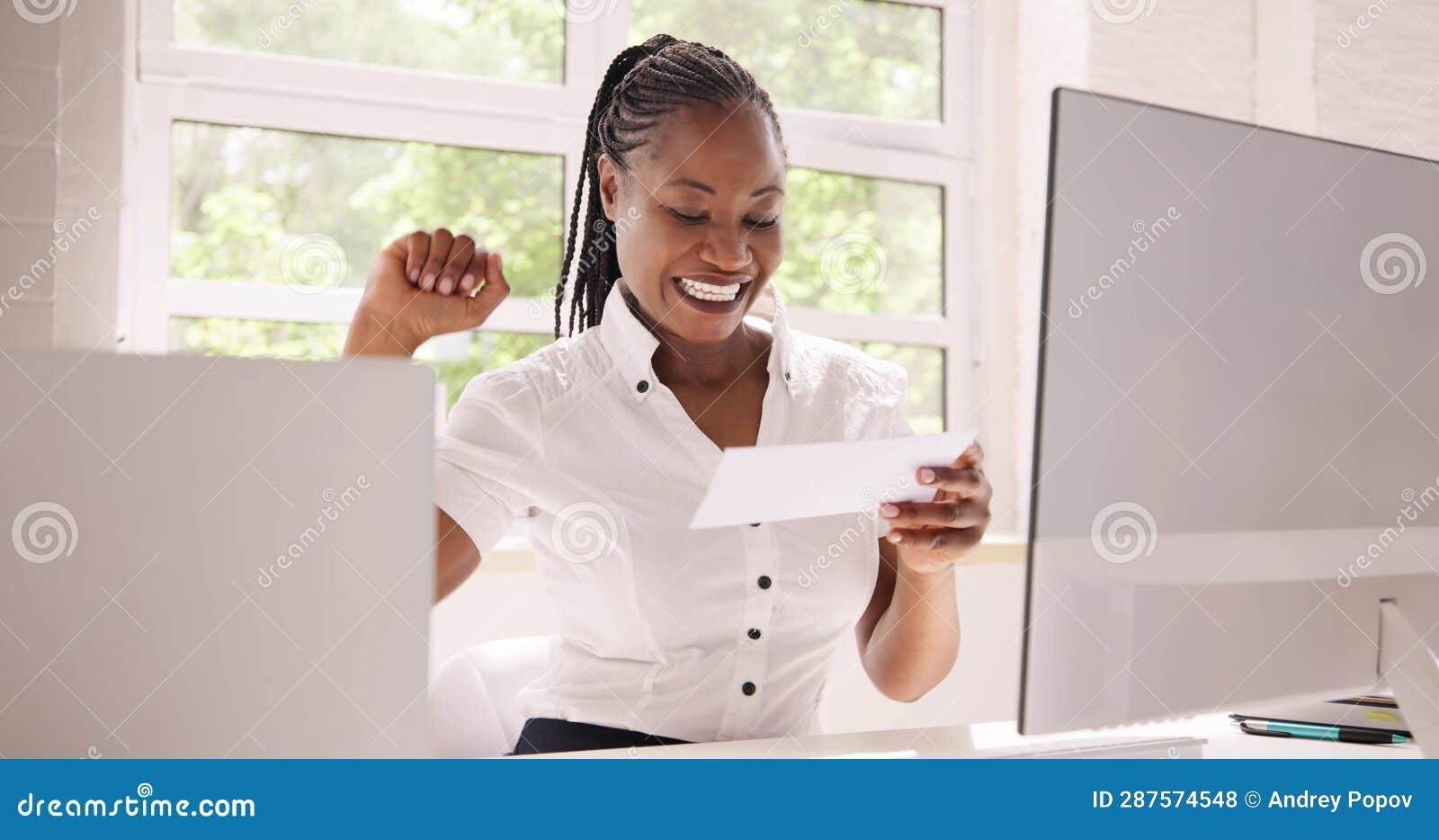 Holding Paycheck or Payroll Check or Insurance Cheque Stock Photo