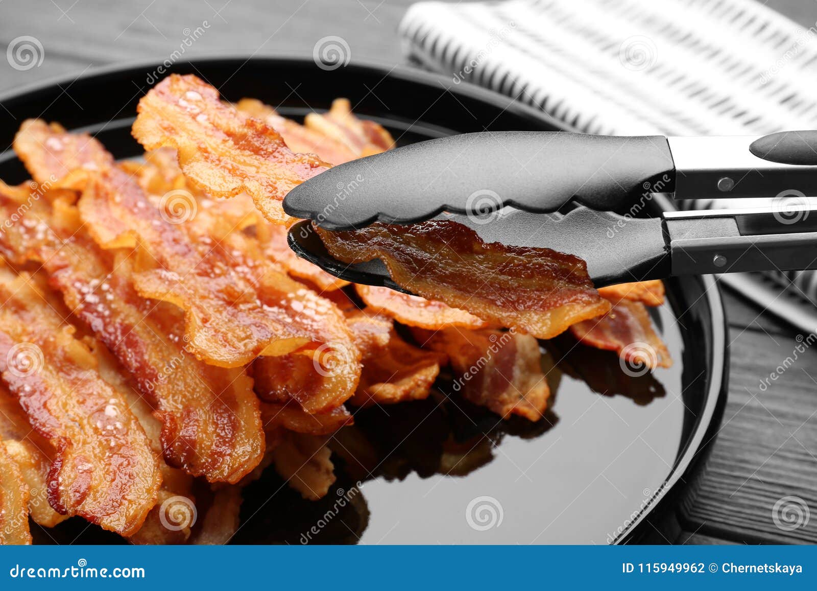 Holding Tasty Bacon Slice with Tongs Plate Stock Photo - Image of pork,  appetizer: 115949962