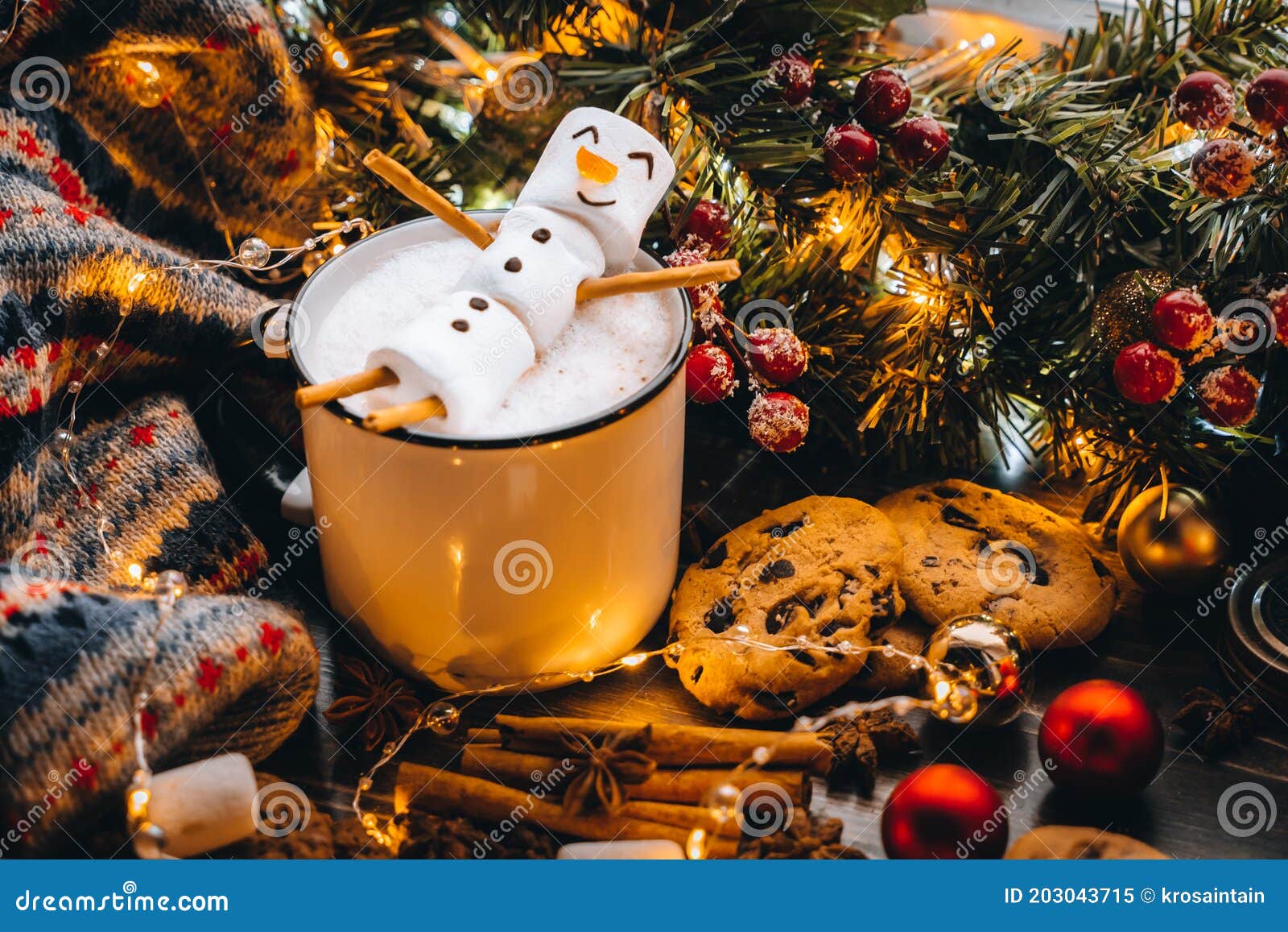 holiday food white mug with hot chocolate cocoa snowman marshmallows. homemade sweet cookie, cinnamon sticks fir xmas tree branche