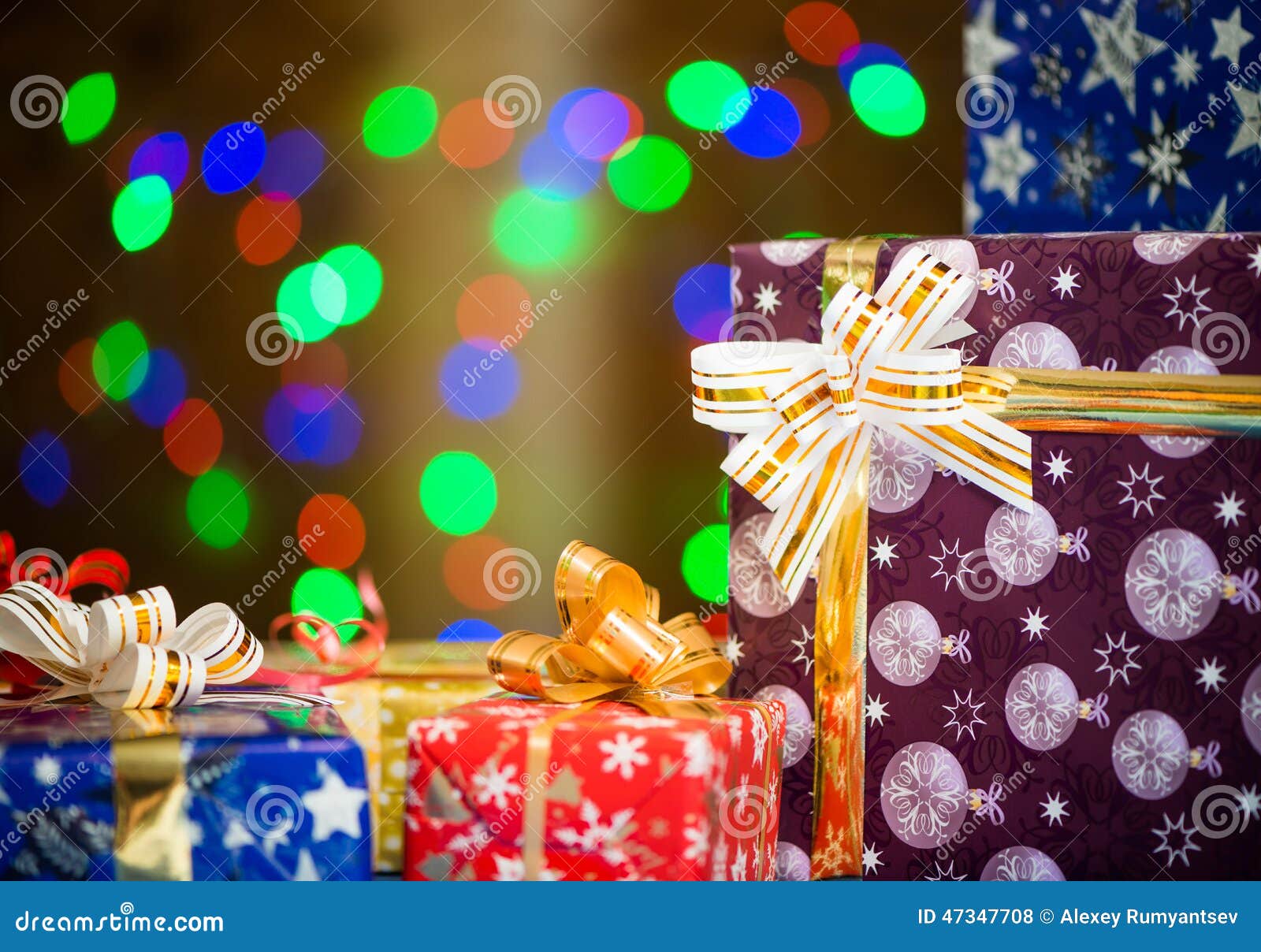 Holiday Presents at Abstract Background Stock Photo - Image of ribbons ...